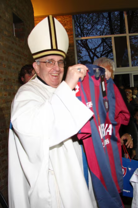 Pope Francis holding a San Lorenzo soccer jersey